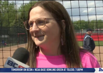 Christine Kwaitkowski Throws First Pitch In Bedford’s Breast Cancer Awareness 15-0 Shutout Win